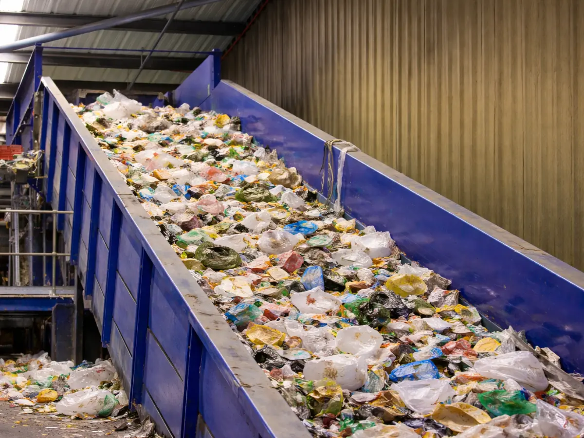 overflowing recycling coveyor belt