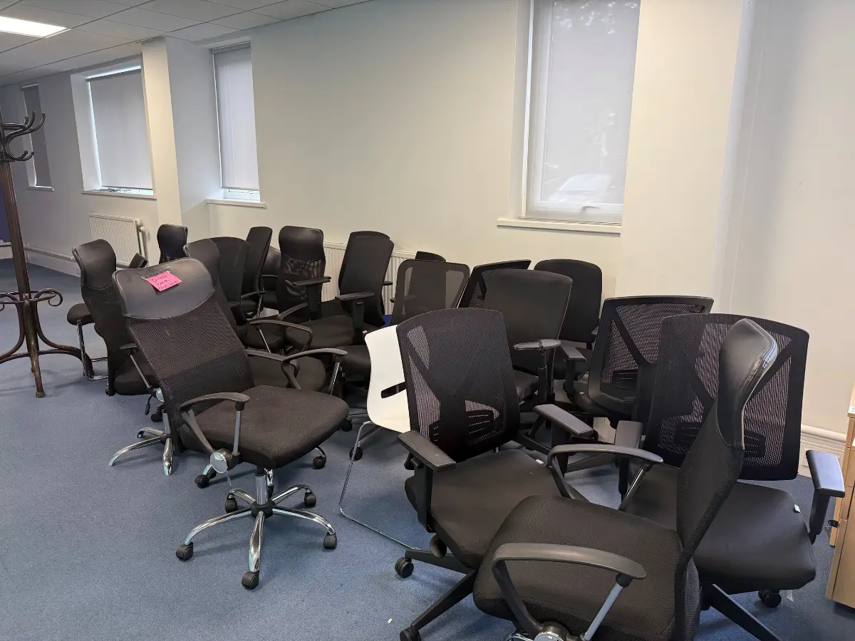 Collection of office chairs ready for reuse, recycling or removal during an office clearance.