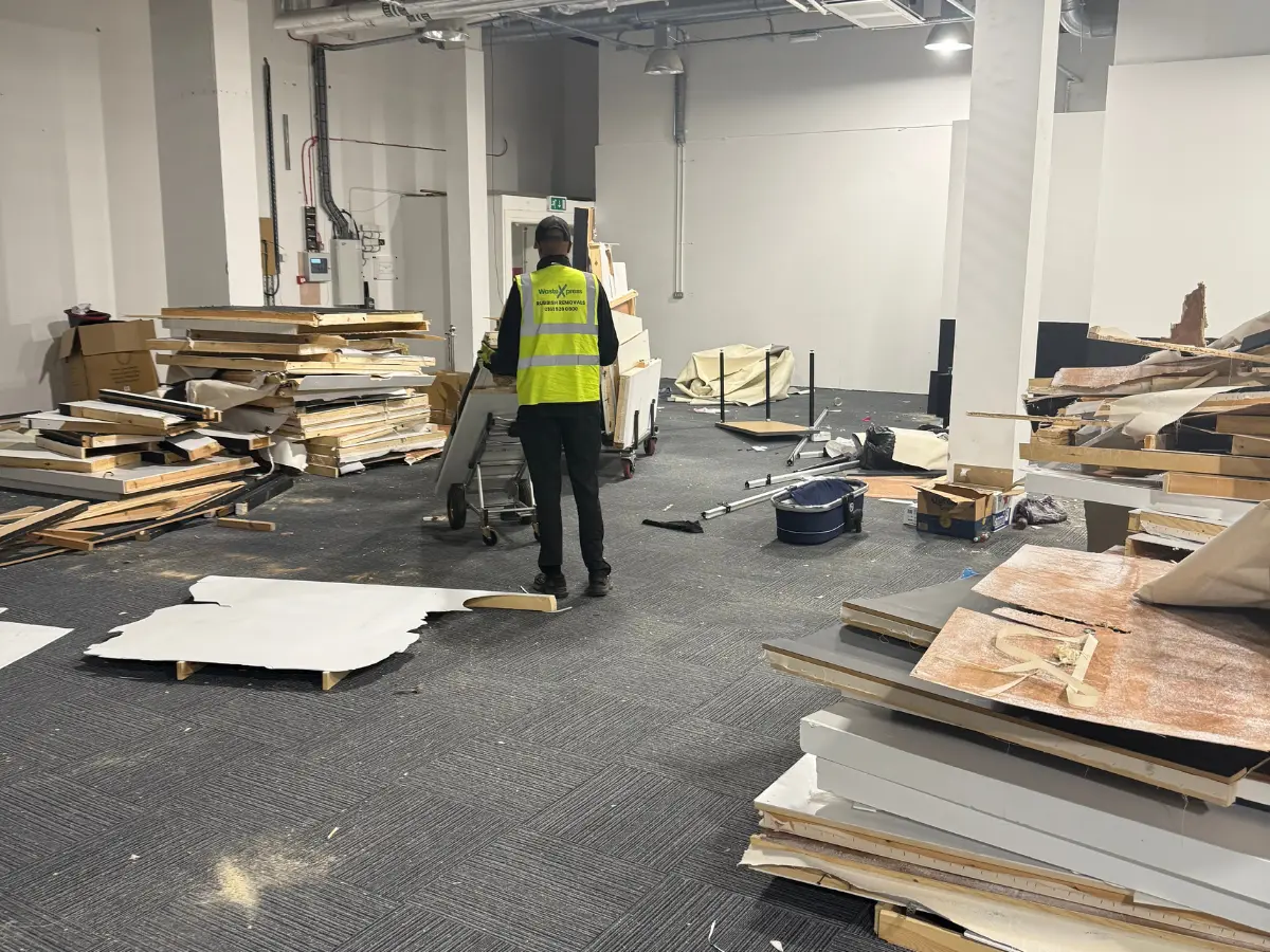 WasteXpress team member clearing materials from a large commercial office.