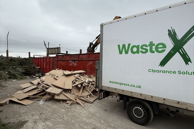 Large pile of cardboard waste collected for recycling by WasteXpress Manchester