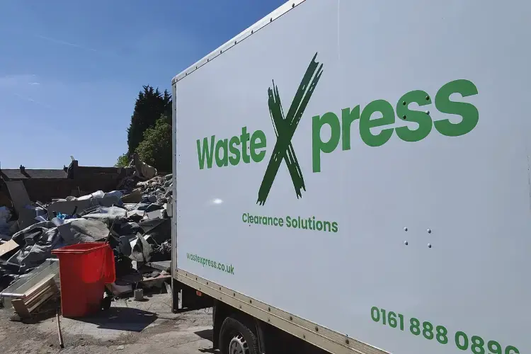 WasteXpress vehicle transporting collected waste for responsible disposal and recycling in Manchester.