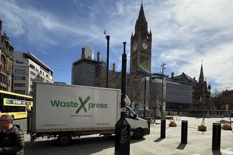WasteXpress clearance van operating in Manchester city centre while providing professional property clearance services.