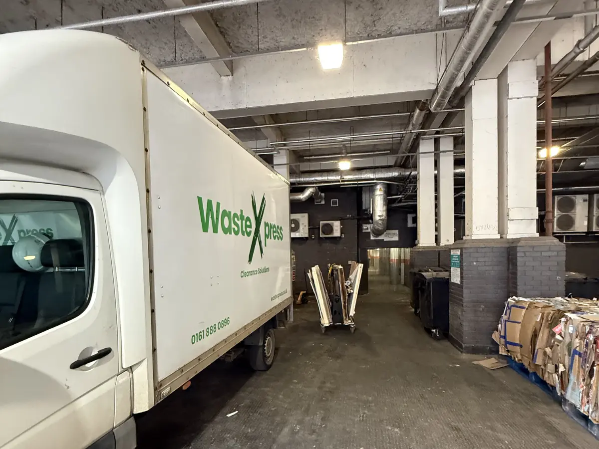 WasteXpress commercial waste collection vehicle at a licensed recycling facility in Manchester, supporting compliant business waste disposal.