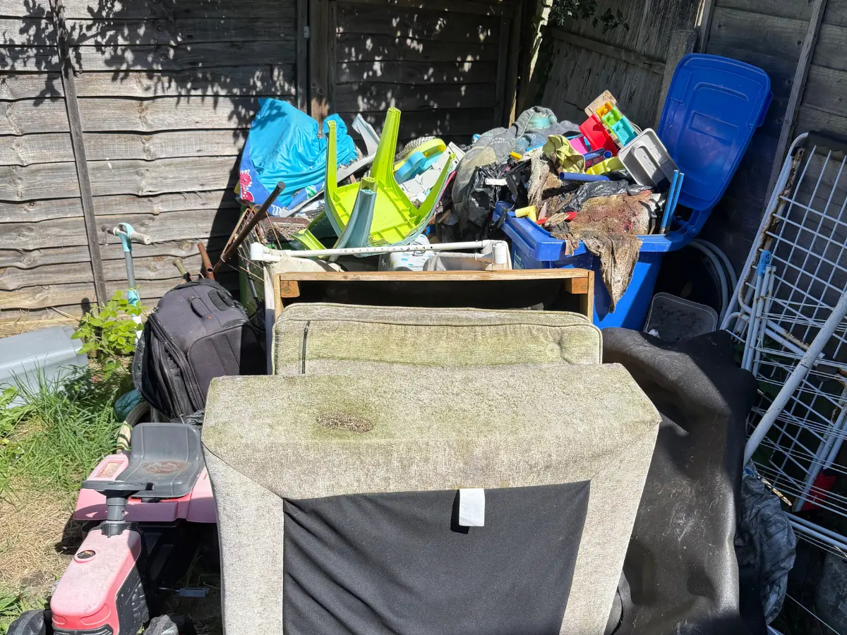 Large amount of household furniture and rubbish ready for collection in Manchester.