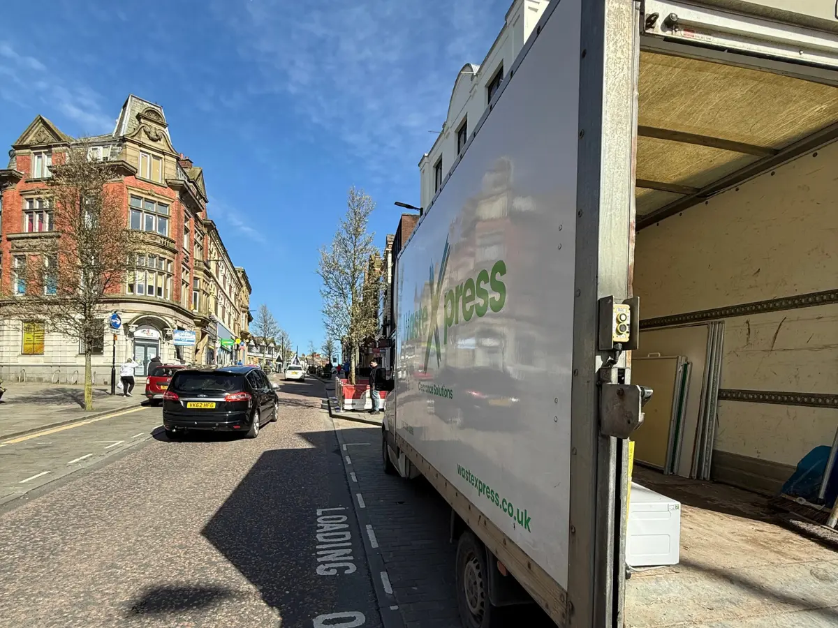 WasteXpress rubbish removal van carrying out a waste collection in Manchester.